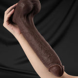 black silicone dildo shown in hand