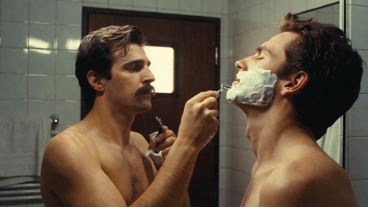two_men_shaving_in_a_bathroom